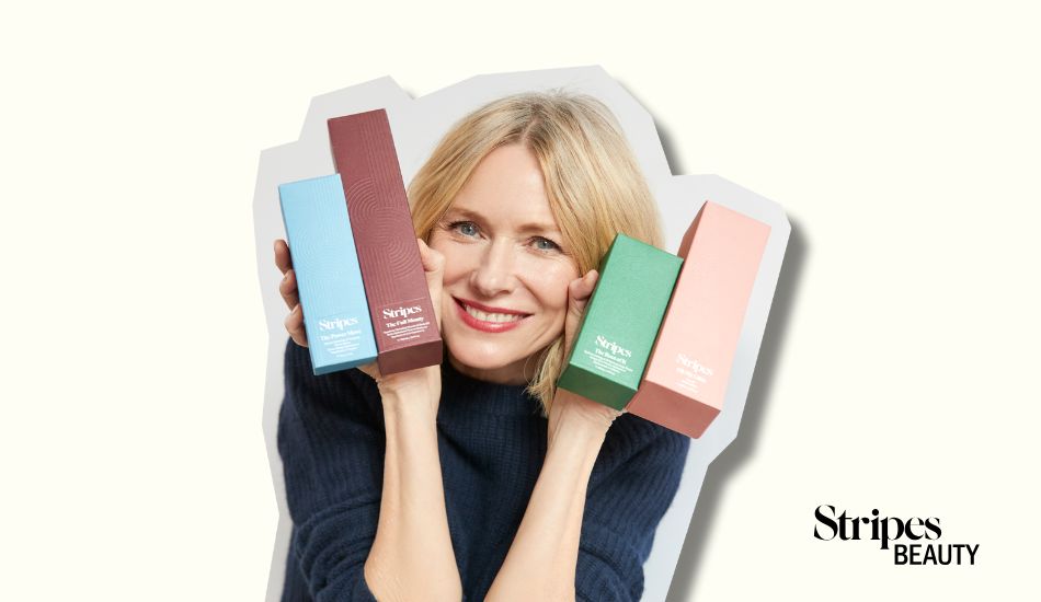 Smiling woman holding colorful skincare product boxes with Stripes Beauty eGift Card logo in the corner