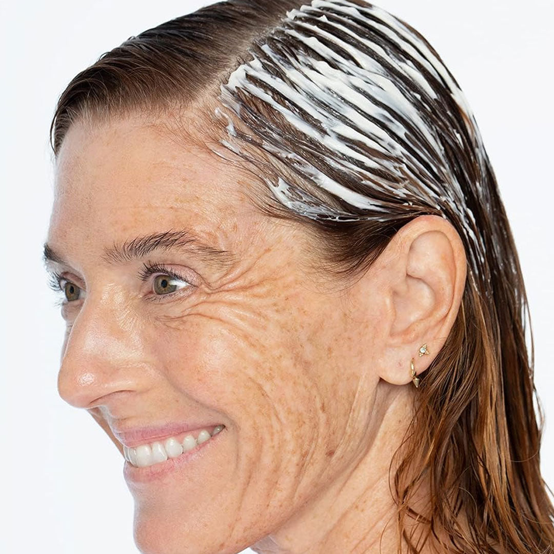 Meno Hair Essentials applied on wet hair, showing hydration and conditioning for thicker, shinier, and healthier hair.